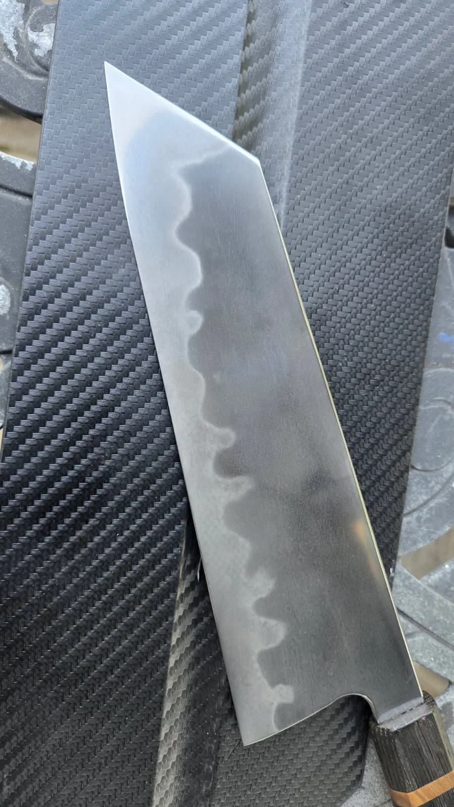 Large hand-forged blade showing a flowing hamon